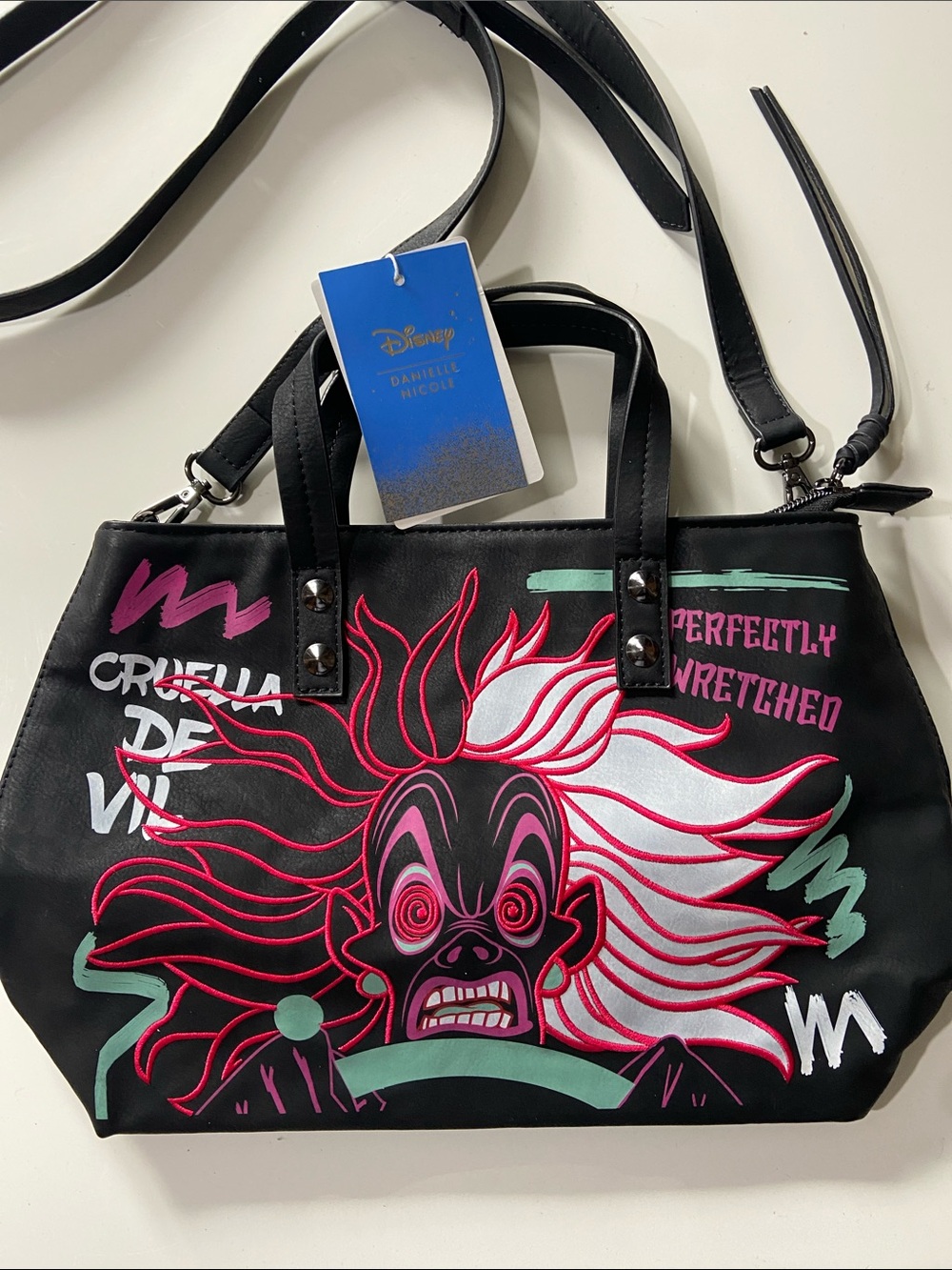 Danielle Nicole X Disney Villains mini tote bag of Cruella De Vil driving